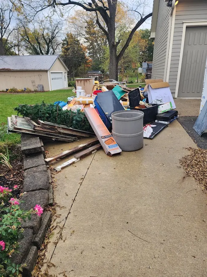 Dumpster being loaded with debris for 3 Yard Dumpster Rental in Belvidere
